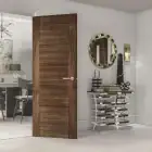 Deanta Seville prefinished internal walnut door in modern interior setting.